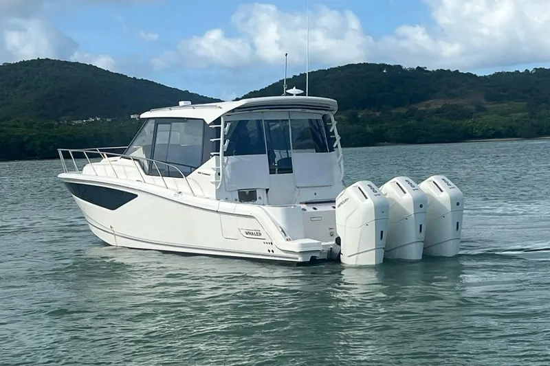  Yacht Photos Pics 2022 Boston Whaler Conquest 405 boat with four engines on a calm lake.