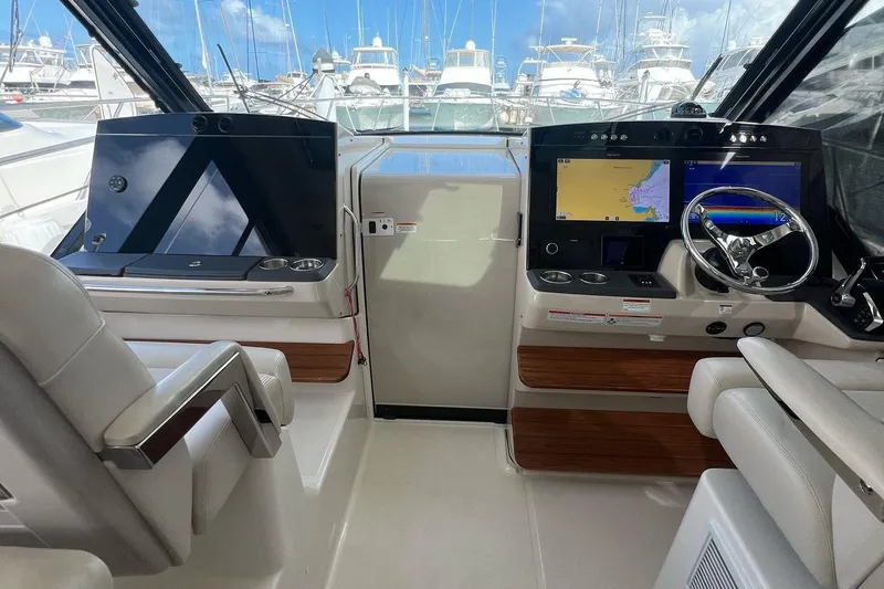  Yacht Photos Pics 2022 Boston Whaler Conquest 405 helm with dual screens and luxurious seating.