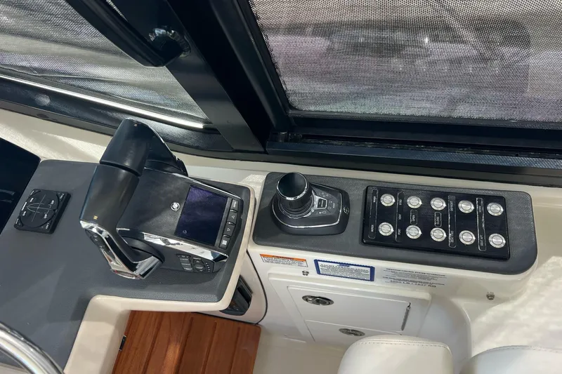  Yacht Photos Pics Control panel of 2022 Boston Whaler Conquest 405 boat, featuring navigation and control systems.