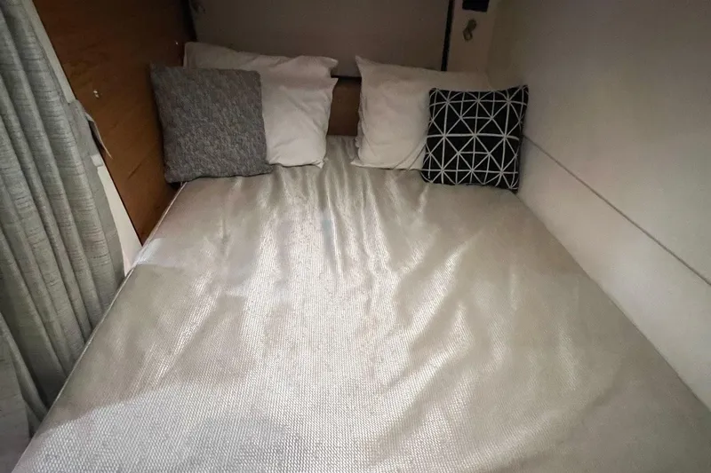  Yacht Photos Pics Cozy cabin bed in 2022 Boston Whaler Conquest 405 with decorative pillows.