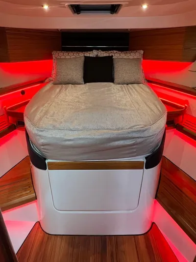  Yacht Photos Pics Luxurious cabin interior of 2022 Boston Whaler Conquest 405 with ambient red lighting.