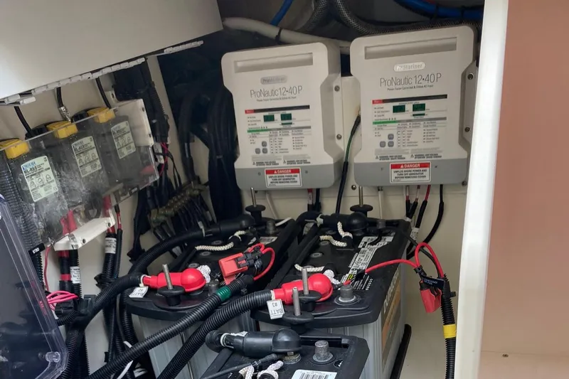  Yacht Photos Pics Electrical system of a 2022 Boston Whaler Conquest 405 boat, featuring batteries and chargers.