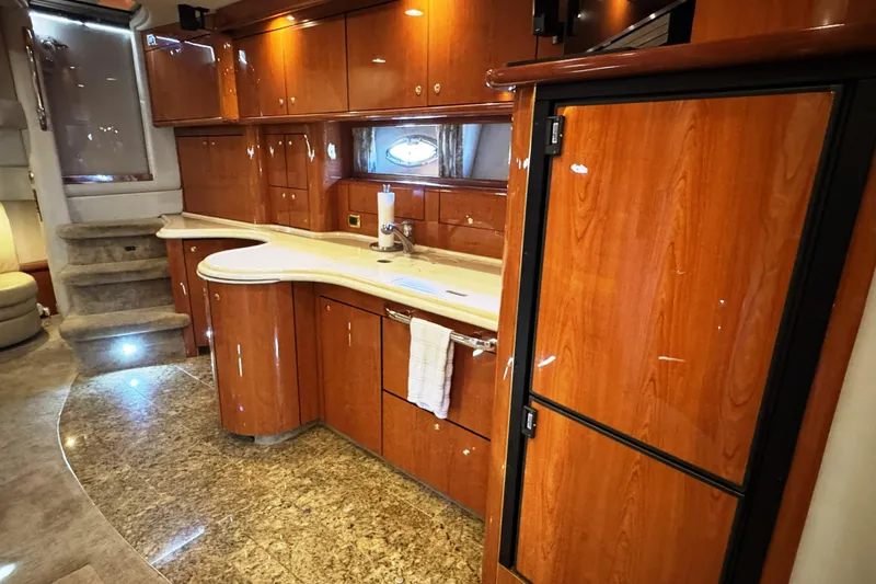 Yacht Photos Pics Luxurious 2001 Sea Ray Sundancer 510 yacht interior with elegant wood cabinetry and modern amenities.