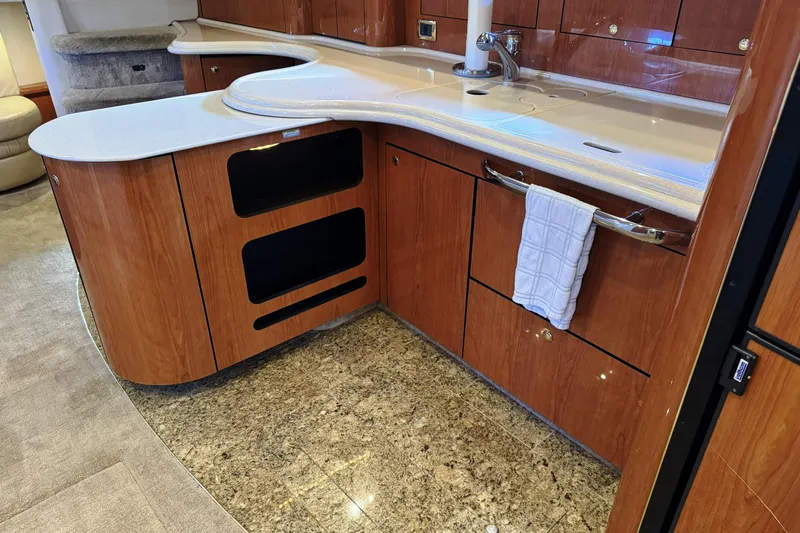  Yacht Photos Pics Luxurious kitchen area in 2001 Sea Ray Sundancer 510 yacht with wood cabinetry and granite flooring.
