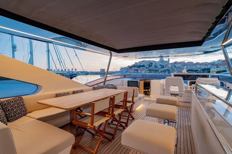 7 Seconds Yacht Photos Pics Luxurious 2015 Dreamline 26 yacht interior with elegant seating and scenic harbor view.