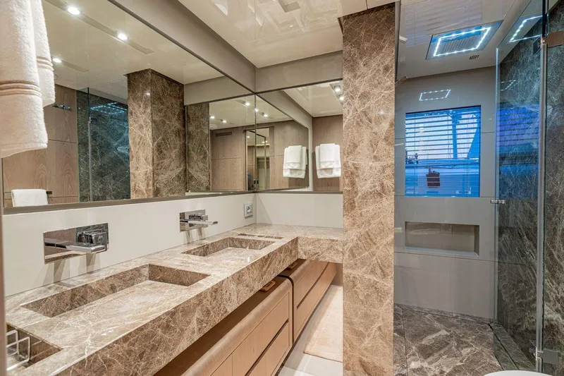 7 Seconds Yacht Photos Pics Luxurious bathroom in 2015 Dreamline 26 yacht with marble countertops and modern fixtures.