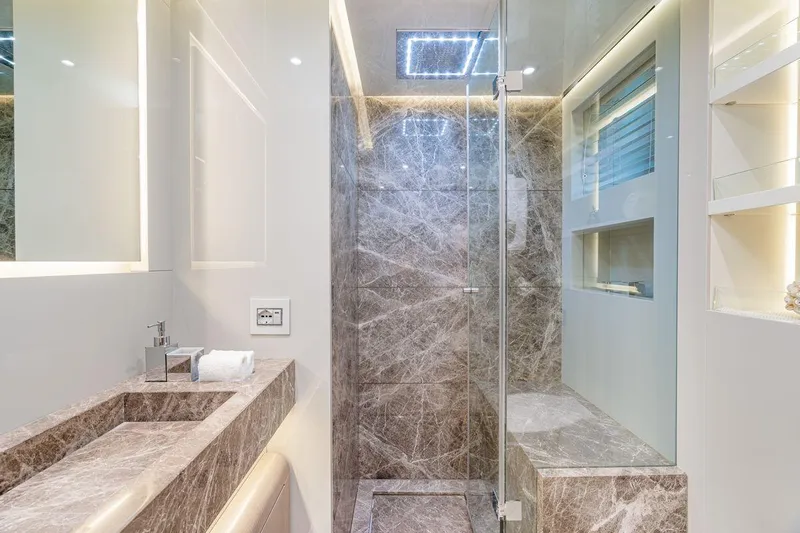 7 Seconds Yacht Photos Pics Luxurious marble bathroom with glass shower in 2015 Dreamline 26 model yacht.