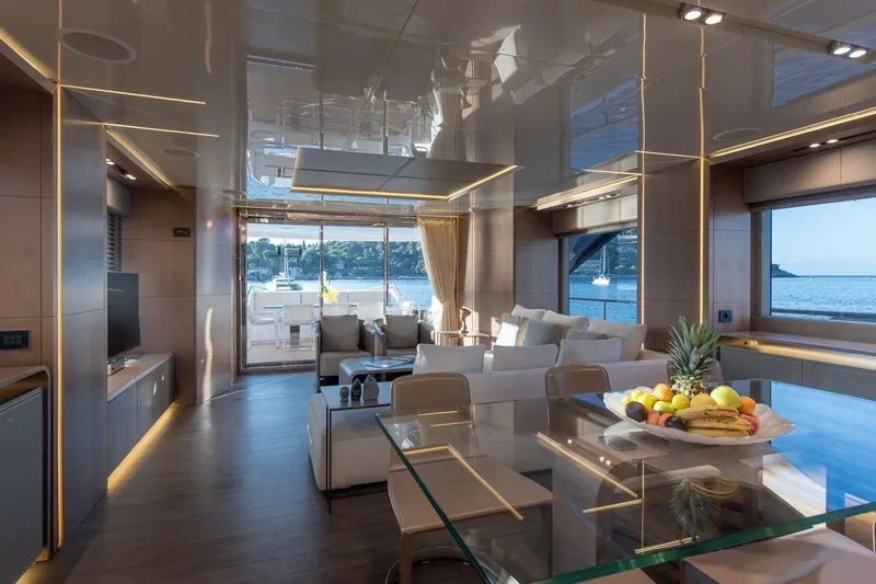 7 Seconds Yacht Photos Pics Luxurious Dreamline 26 yacht interior, featuring elegant seating, glass table, and scenic ocean views.