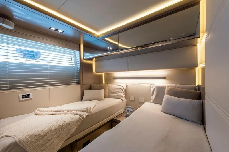 7 Seconds Yacht Photos Pics Luxurious Dreamline 26 yacht cabin interior, 2015 model, featuring twin beds and modern lighting.