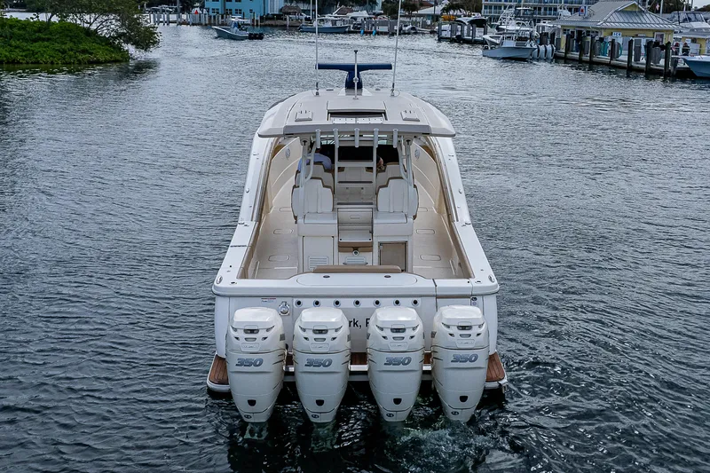  Yacht Photos Pics 2019 Scout 420 LXF boat with four powerful engines on a calm waterway.