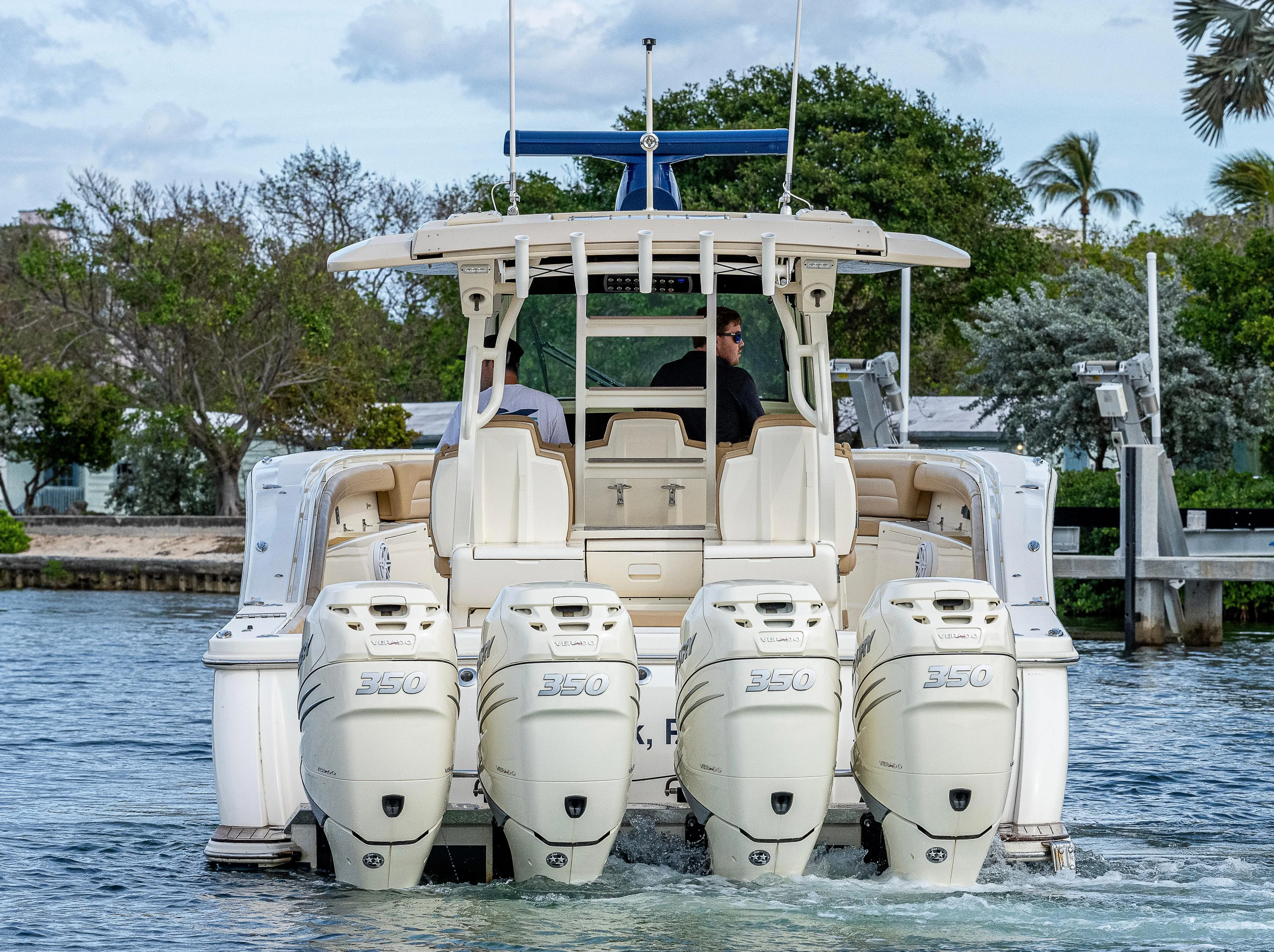  Yacht Photos Pics 2019 Scout 420 LXF boat with four powerful engines cruising on water.