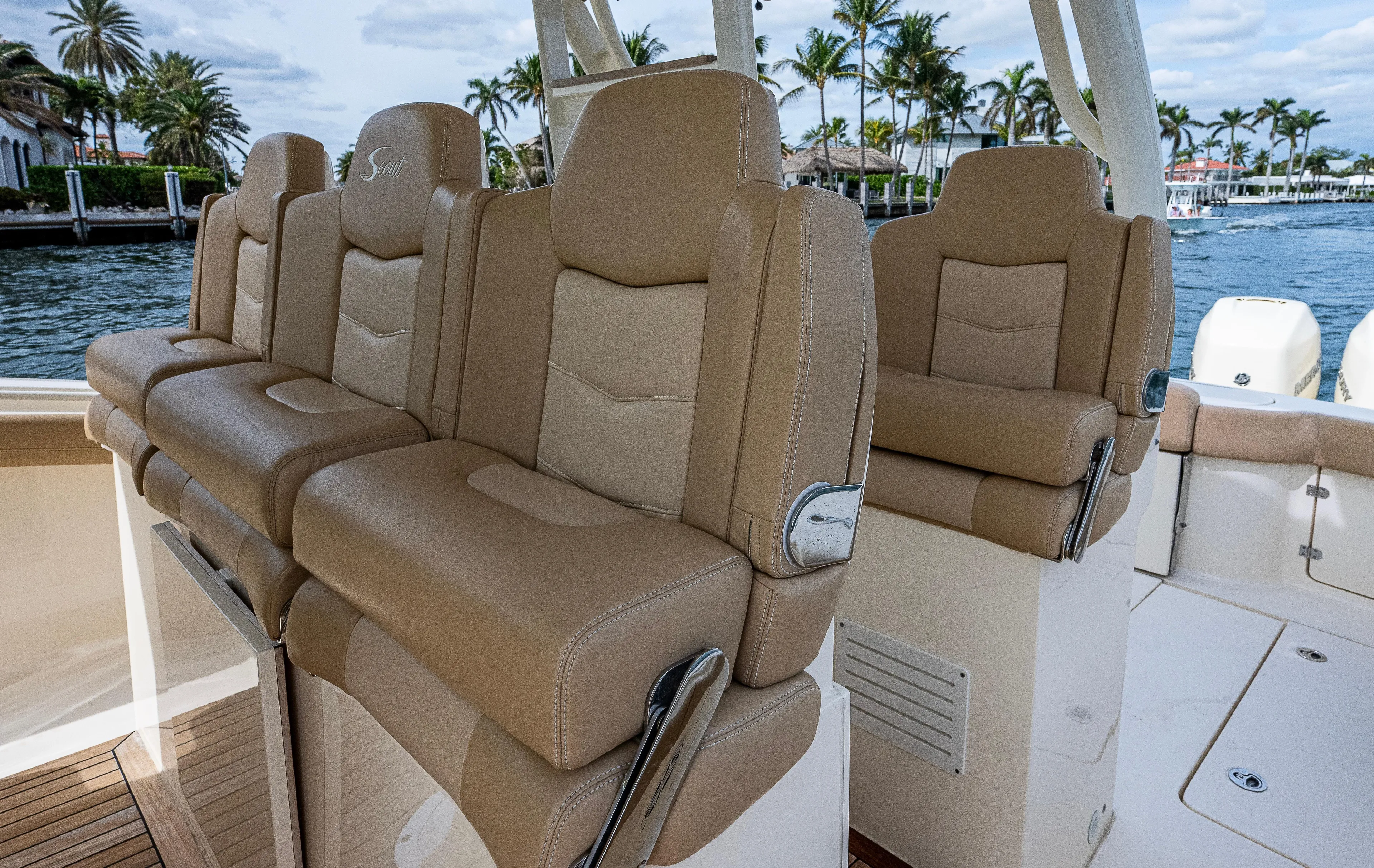  Yacht Photos Pics 2019 Scout 420 LXF boat with luxurious tan seating, dockside view.