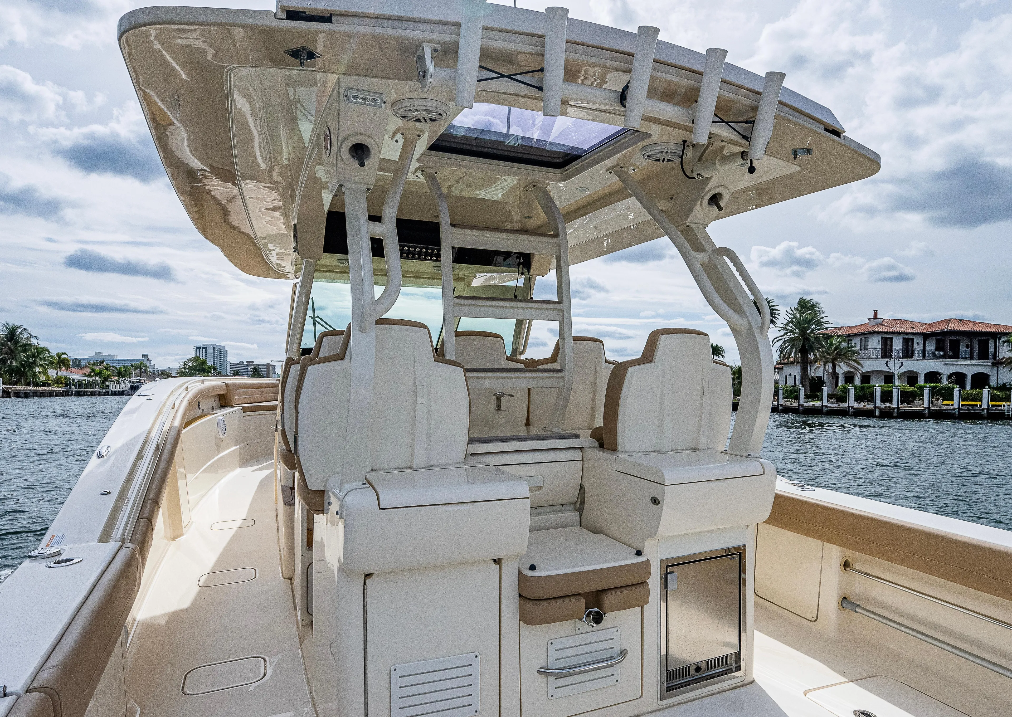  Yacht Photos Pics 2019 Scout 420 LXF boat interior with luxurious seating and modern design on a sunny day.