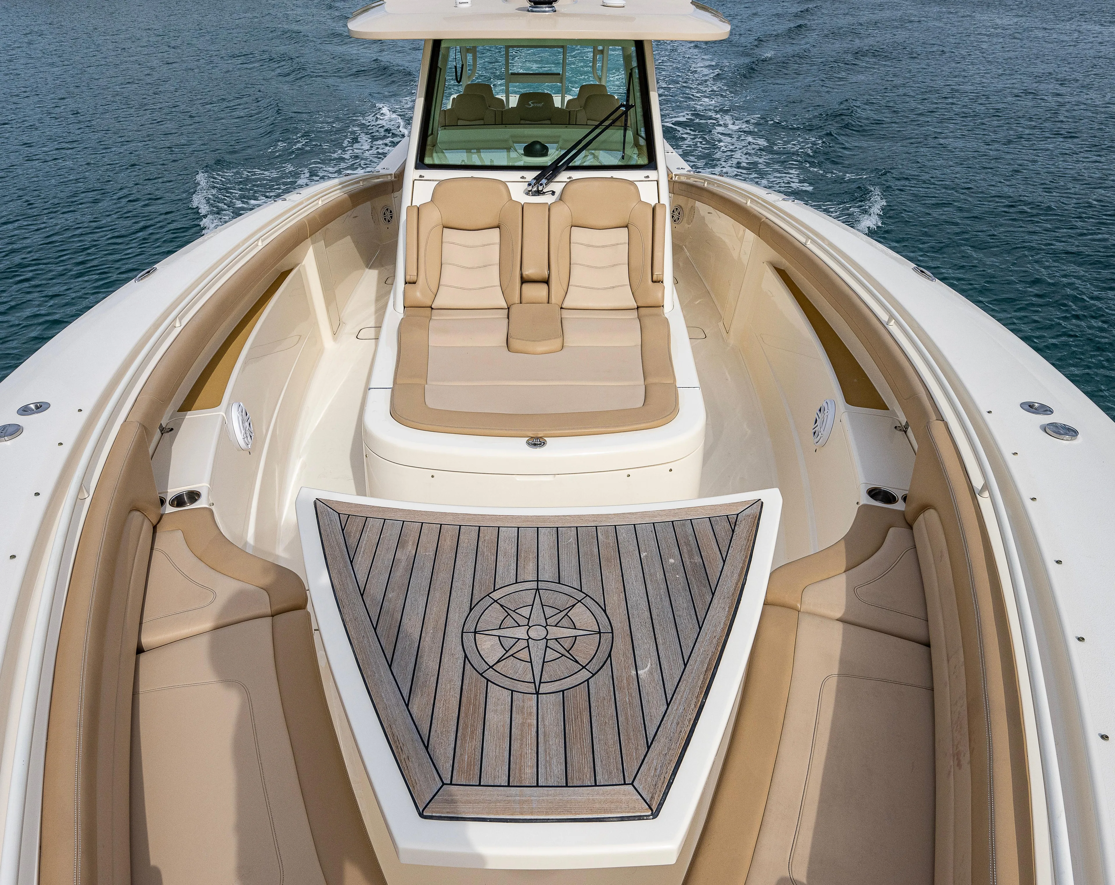  Yacht Photos Pics 2019 Scout 420 LXF boat with luxurious seating and teak deck on open water.