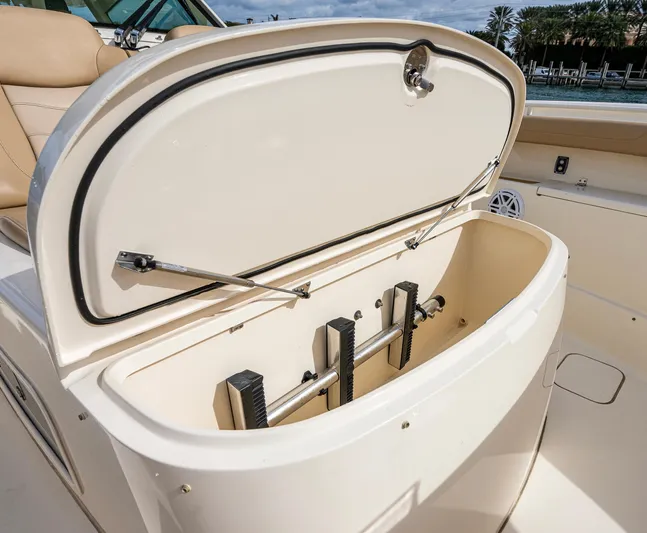  Yacht Photos Pics 2019 Scout 420 LXF boat storage compartment open, showcasing interior features.