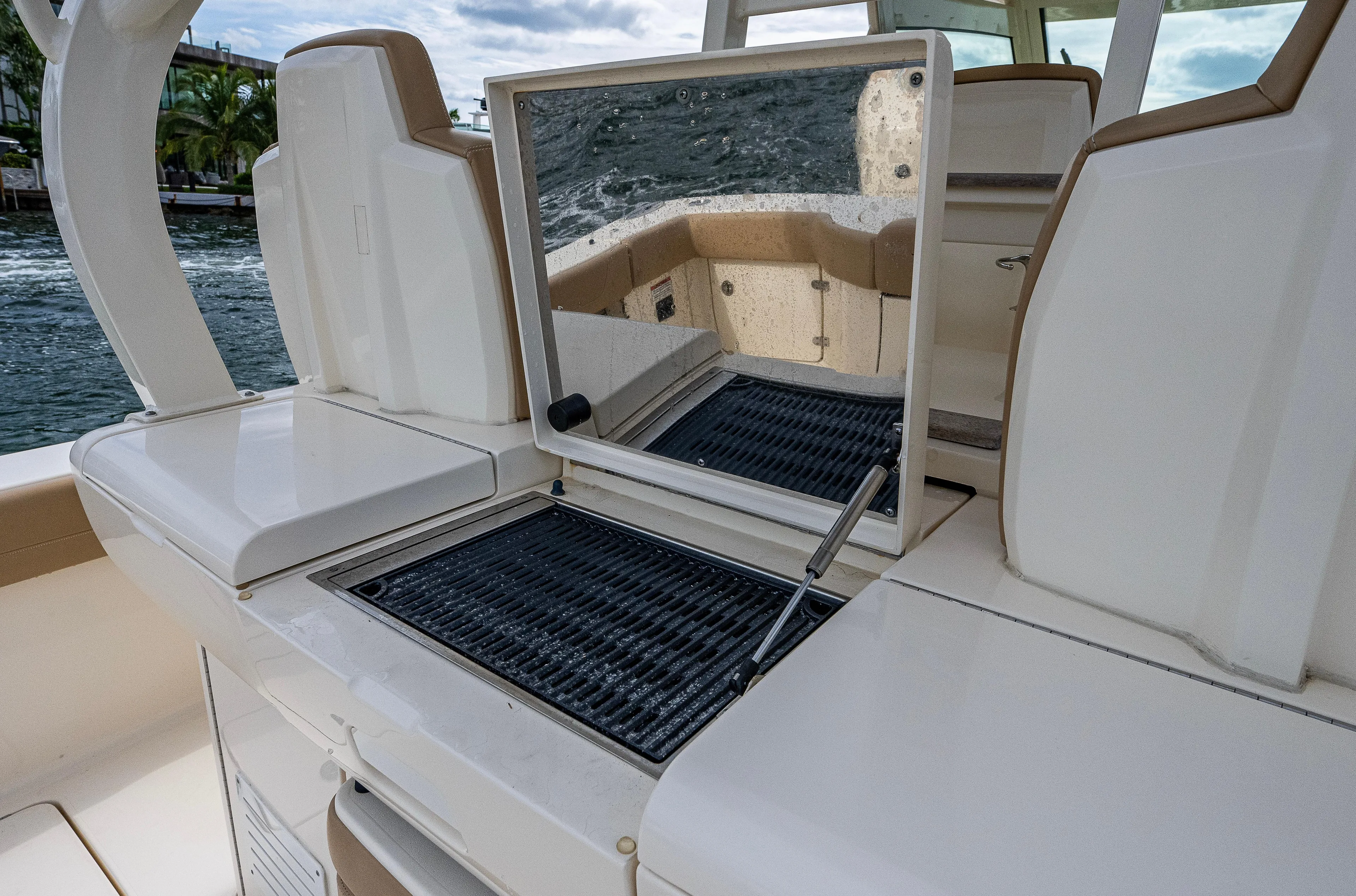  Yacht Photos Pics 2019 Scout 420 LXF boat interior with seating and storage compartments.