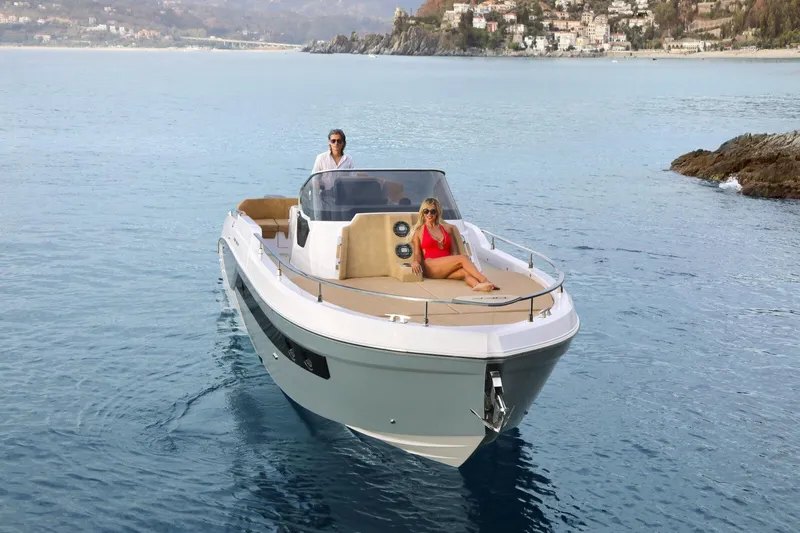  Yacht Photos Pics 2025 Ranieri NEXT 330 XL boat cruising on serene waters with passengers.