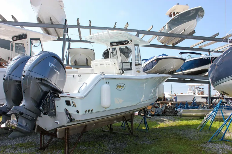  Yacht Photos Pics 2023 Sea Hunt Gamefish 27 Coffin Box boat with dual Yamaha engines in storage.