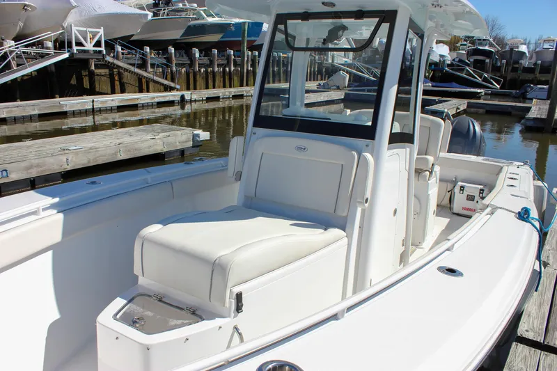  Yacht Photos Pics 2023 Sea Hunt Gamefish 27 with Coffin Box, docked at a marina.