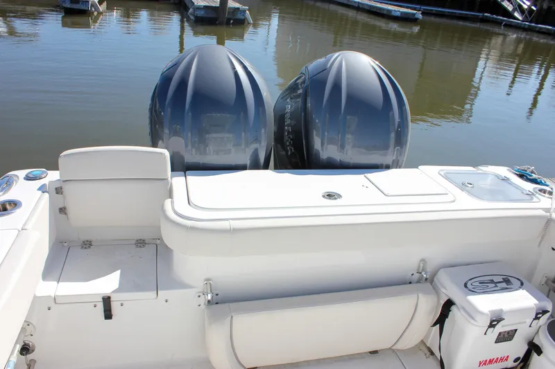  Yacht Photos Pics 2023 Sea Hunt Gamefish 27 boat with twin engines and coffin box, docked in marina.
