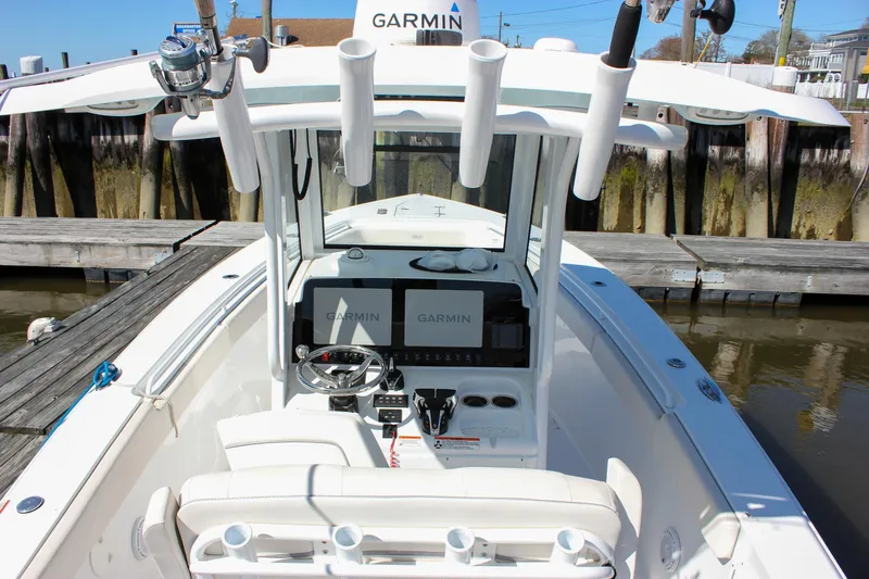  Yacht Photos Pics 2023 Sea Hunt Gamefish 27 with Coffin Box, featuring Garmin electronics and rod holders.