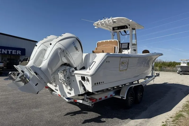  Yacht Photos Pics 2026 Sea Hunt Gamefish 27 boat with dual Yamaha engines on a trailer.