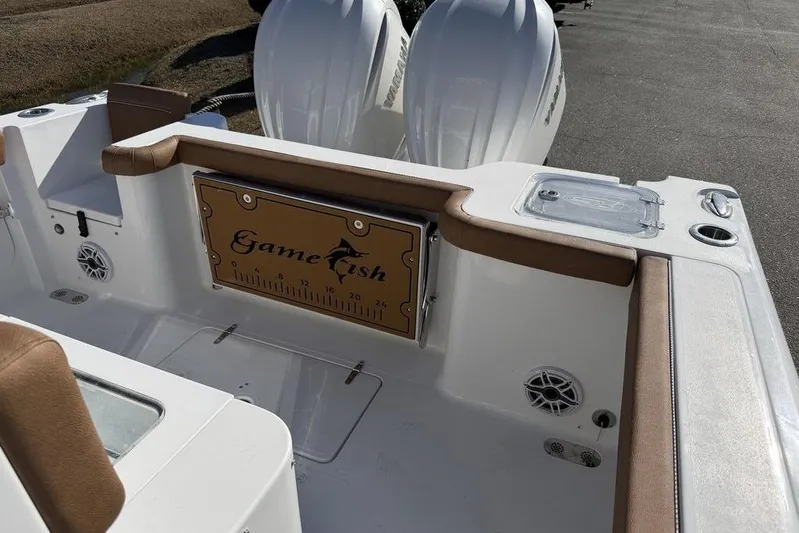  Yacht Photos Pics 2026 Sea Hunt Gamefish 27 boat interior with fishing rod holders and dual engines.