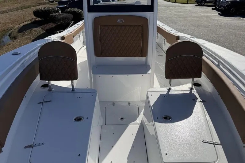  Yacht Photos Pics 2026 Sea Hunt Gamefish 27 boat interior with cushioned seating and storage compartments.