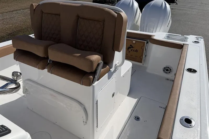  Yacht Photos Pics 2026 Sea Hunt Gamefish 27 boat interior with cushioned seating and dual engines.