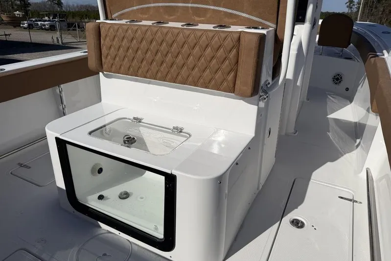  Yacht Photos Pics 2026 Sea Hunt Gamefish 27 boat interior with cushioned seating and storage compartment.