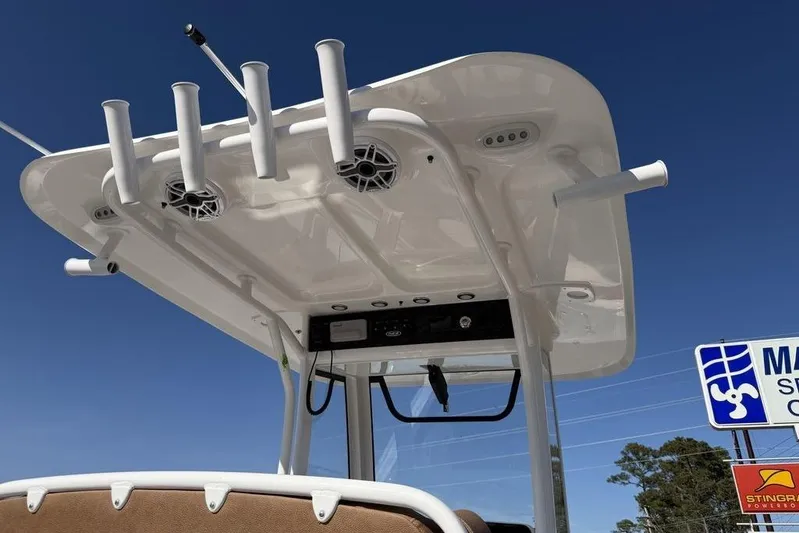  Yacht Photos Pics 2026 Sea Hunt Gamefish 27 boat top with rod holders and speakers under clear sky.