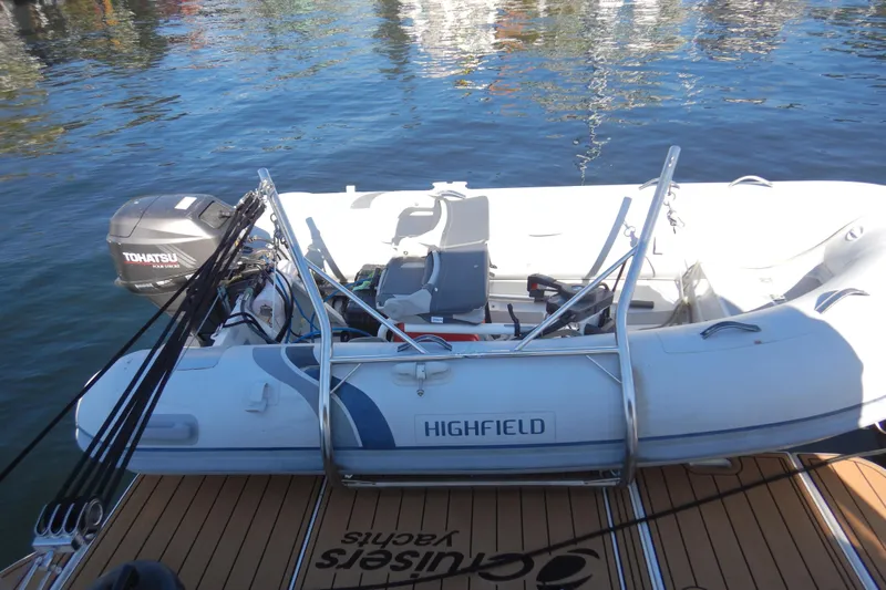 Sunny Daze Yacht Photos Pics 2007 Cruisers 340 Express with Highfield inflatable boat and Tohatsu motor on water.