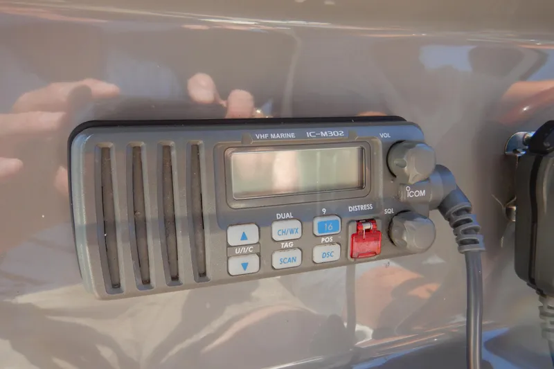 Sunny Daze Yacht Photos Pics VHF marine radio on 2007 Cruisers 340 Express boat dashboard.