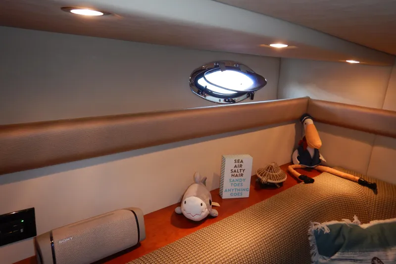 Sunny Daze Yacht Photos Pics 2007 Cruisers 340 Express cabin interior with plush toys and decorative items.