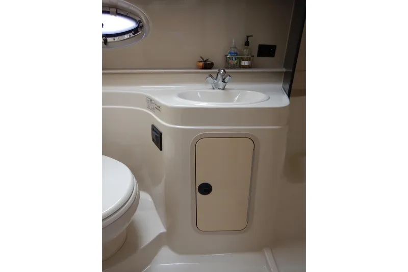 Sunny Daze Yacht Photos Pics Bathroom interior of 2007 Cruisers 340 Express yacht, featuring sink and storage.