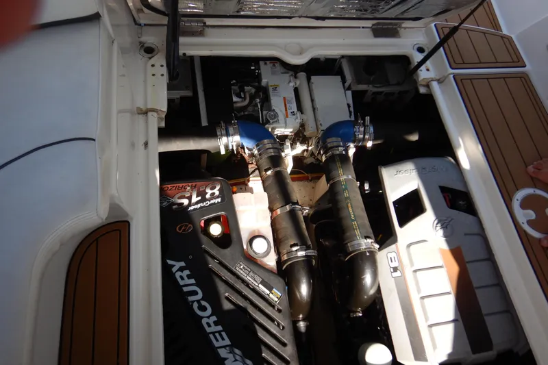 Sunny Daze Yacht Photos Pics 2007 Cruisers 340 Express engine compartment with Mercury 8.1 engines and detailed components.