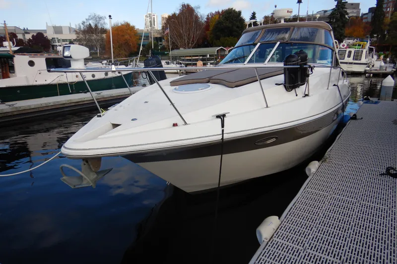 Sunny Daze Yacht Photos Pics 2007 Cruisers 340 Express yacht docked at marina, surrounded by autumn foliage.