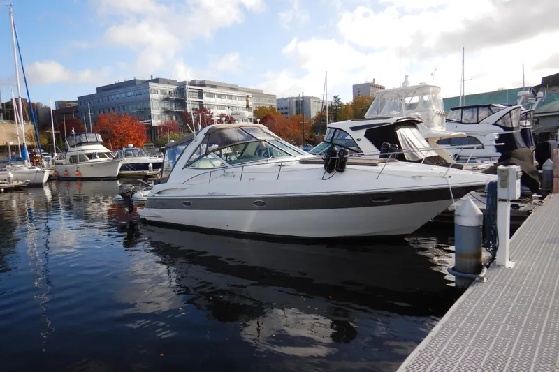 Sunny Daze Yacht Photos Pics 2007 Cruisers 340 Express yacht docked in a marina with surrounding boats.