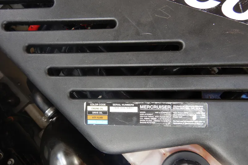 Sunny Daze Yacht Photos Pics Engine cover of a 2007 Cruisers 340 Express with MerCruiser label and specifications.