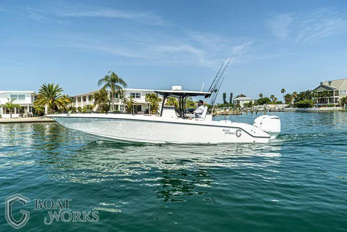 Yacht Photos Pics 2022 CG Boat Works 35 M-Series cruising on a sunny waterfront.
