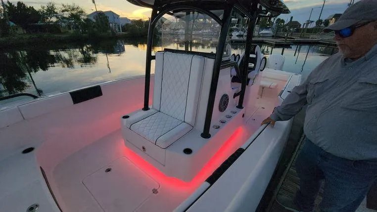  Yacht Photos Pics 2022 CG Boat Works 35 M-Series with illuminated seating and console at sunset.