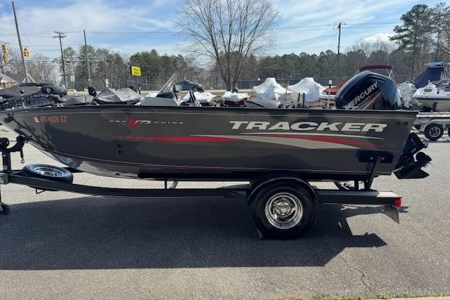 2018 Tracker Pro Guide V-175 SC boat on trailer, parked outdoors.