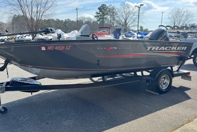 2018 Tracker Pro Guide V-175 SC boat on trailer in outdoor setting.
