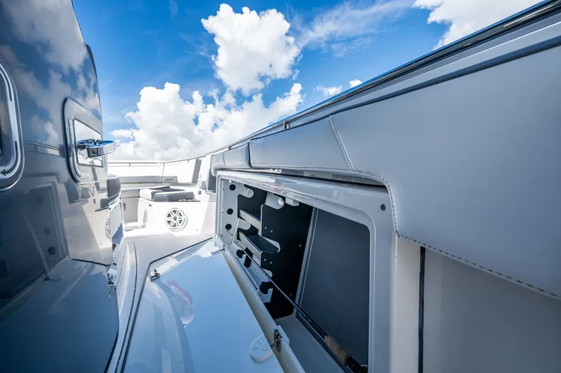 Aurora Yacht Photos Pics 2019 Blackfin 332 boat interior with open storage, sleek design, and blue sky background.