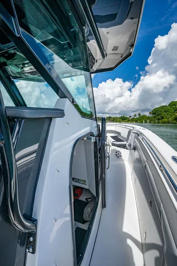 Aurora Yacht Photos Pics 2019 Blackfin 332 boat deck with sleek design, open hatch, and scenic water view.