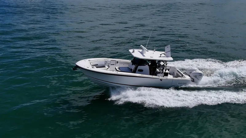Aurora Yacht Photos Pics 2019 Blackfin 332 boat cruising on open water, showcasing sleek design and powerful performance.