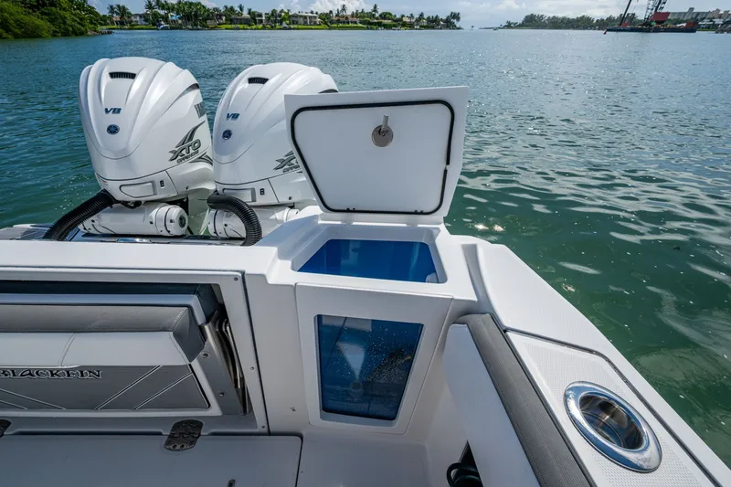 Aurora Yacht Photos Pics 2019 Blackfin 332 boat with dual Yamaha V8 XTO engines on a calm waterway.