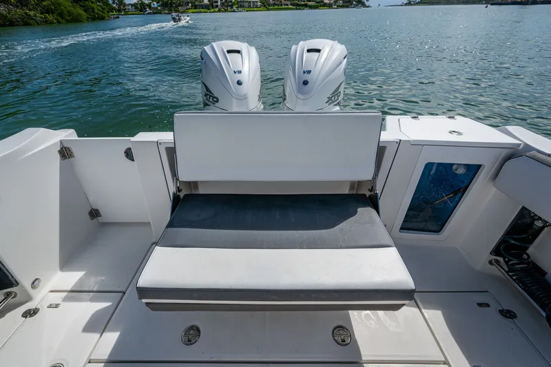 Aurora Yacht Photos Pics 2019 Blackfin 332 boat with dual outboard engines and spacious seating area.