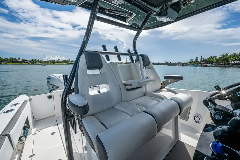 Aurora Yacht Photos Pics 2019 Blackfin 332 boat interior with luxurious seating and scenic water view.