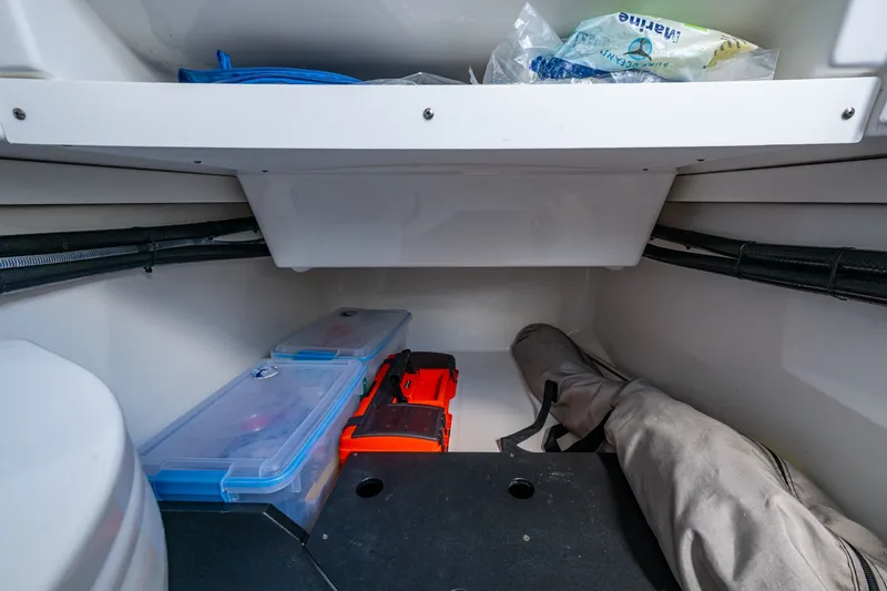 Aurora Yacht Photos Pics Storage compartment in a 2019 Blackfin 332 boat, featuring organized containers and equipment.